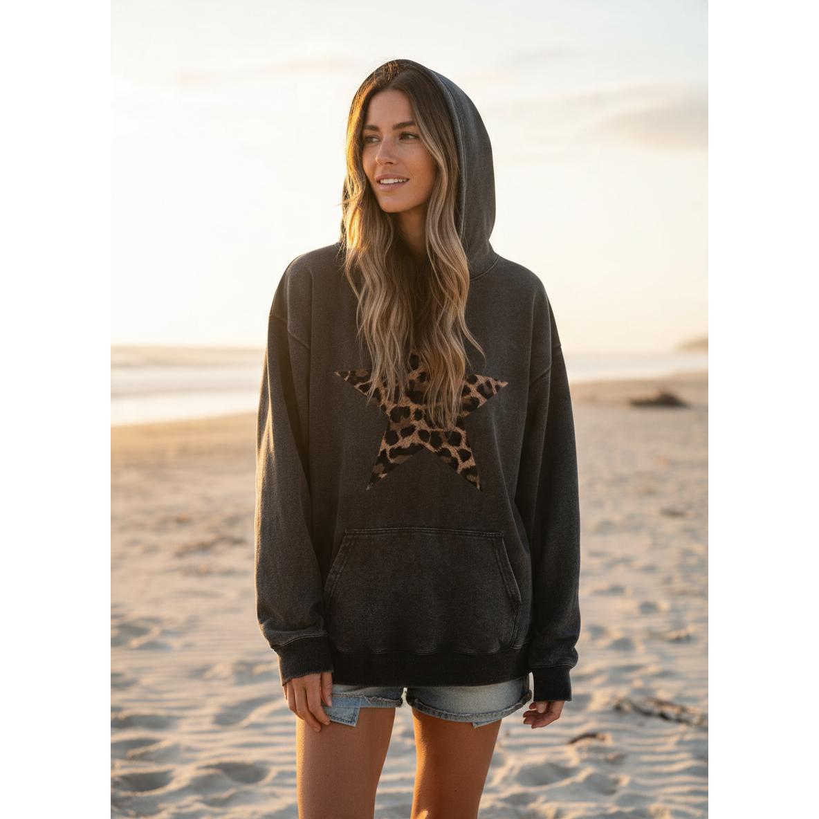 Holafish Acid-Wash Hoodie, Leopard Star Front, model front view in warm beach light.